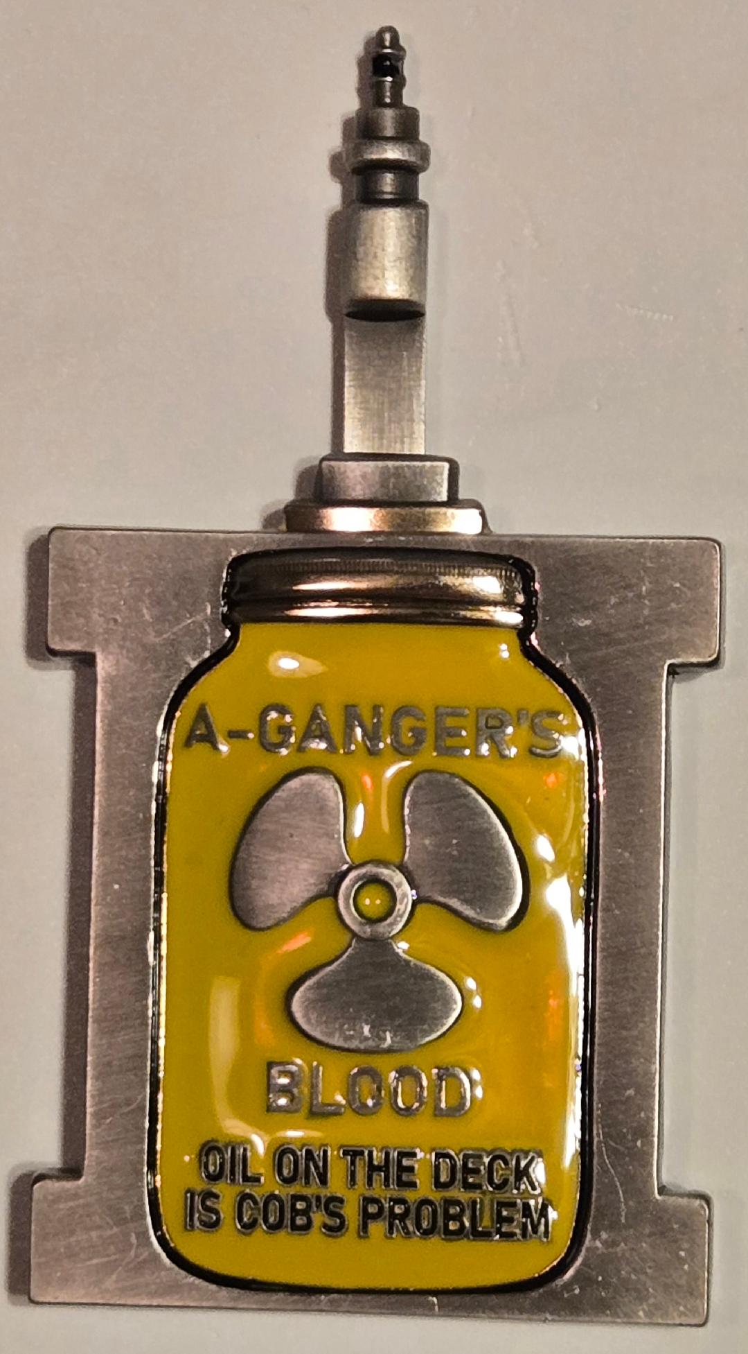 Metallic object with a yellow label featuring a radiation symbol and text on a gray background