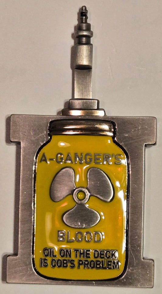 Metallic object with a yellow label featuring a radiation symbol and text on a gray background