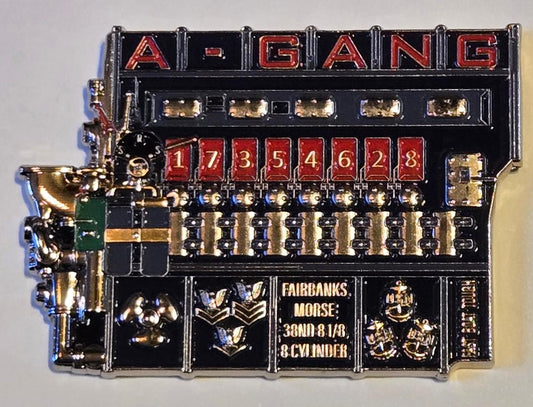 Decorative metal panel with 'A-GANG' branding and various text and symbols on a gray background.