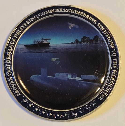 Circular object with submarine design and text on a white background